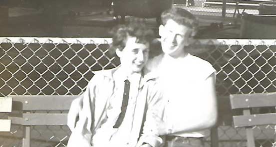 Gene on a bench with his wife