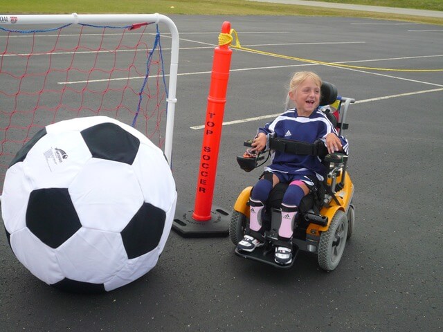 Photo of child Gina Rugari in wheelchair